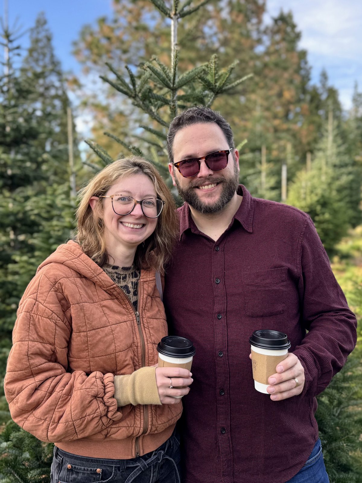 Derek and his wife at a Christmas tree farm